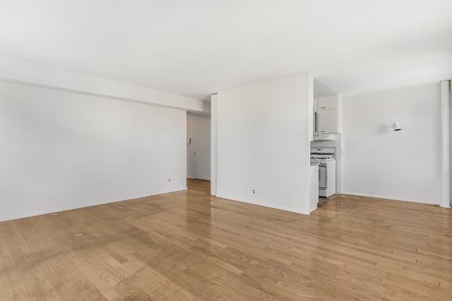 unfurnished living room with light wood-type flooring