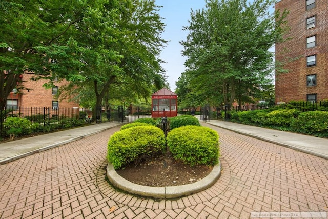 view of home's community featuring fence