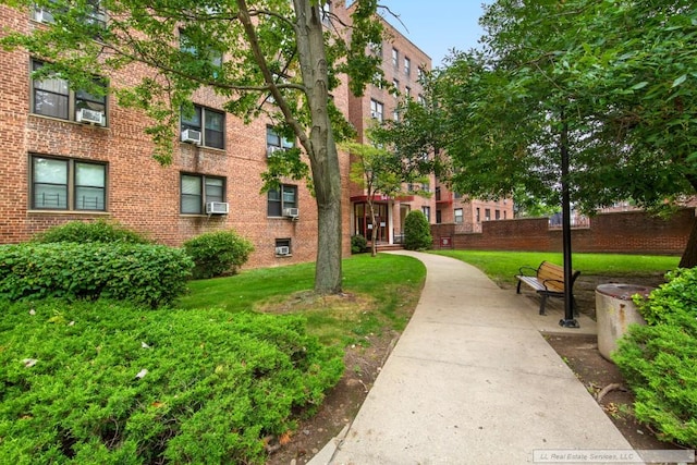 view of property's community featuring a yard