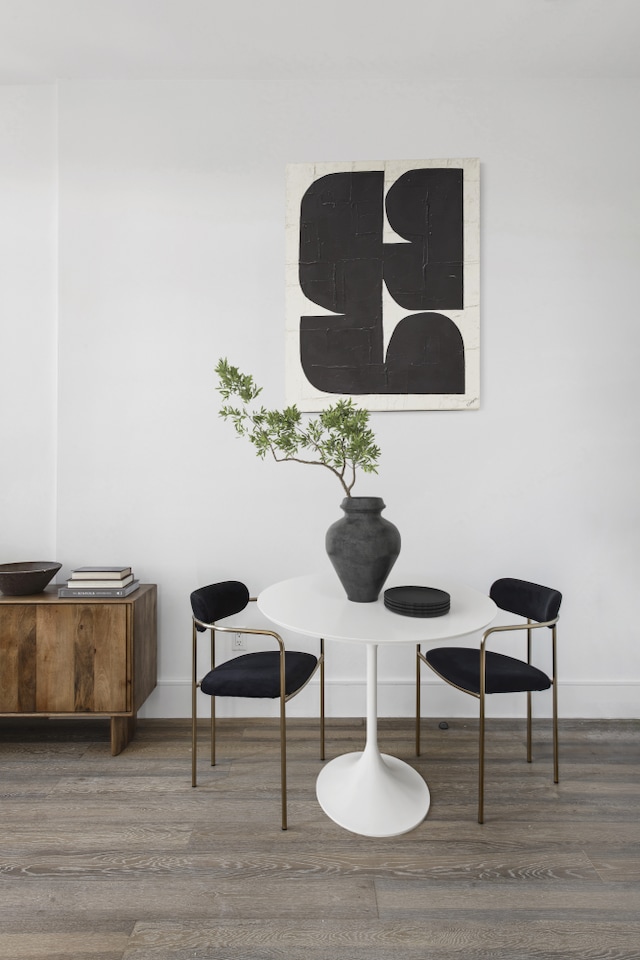 details featuring baseboards and wood finished floors