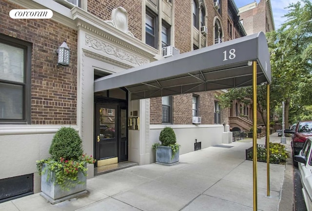 18 W 70th St Unit 8C, New York City, NY 10023 - view of exterior entry with brick siding