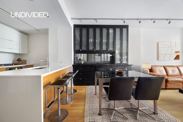 303 E 33rd St Unit 3G, New York City, NY 10016 - dining space featuring track lighting and light wood finished floors