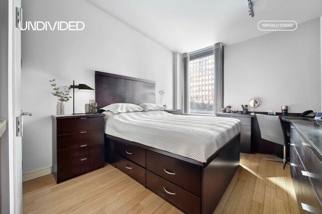 303 E 33rd St Unit 3G, New York City, NY 10016 - bedroom featuring light wood finished floors