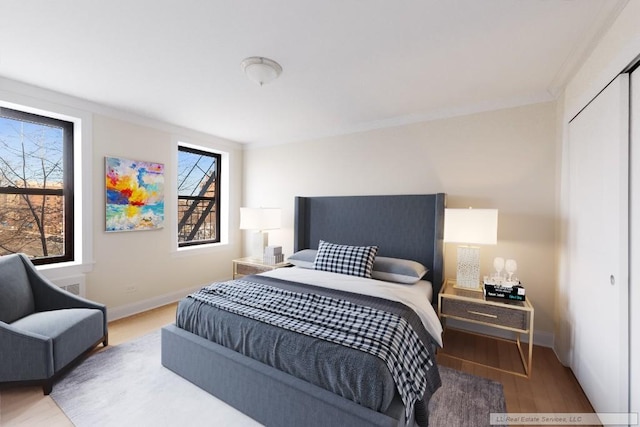 bedroom with hardwood / wood-style flooring and a closet