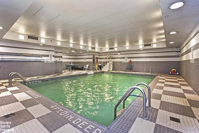 view of swimming pool with a patio