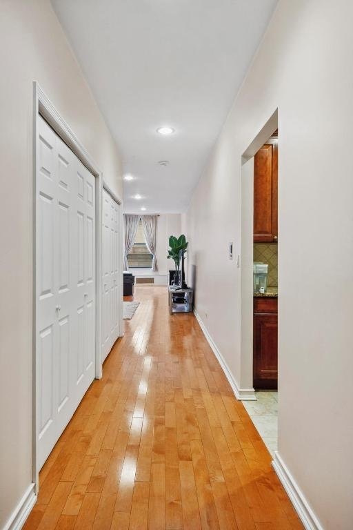 hallway featuring light wood-type flooring