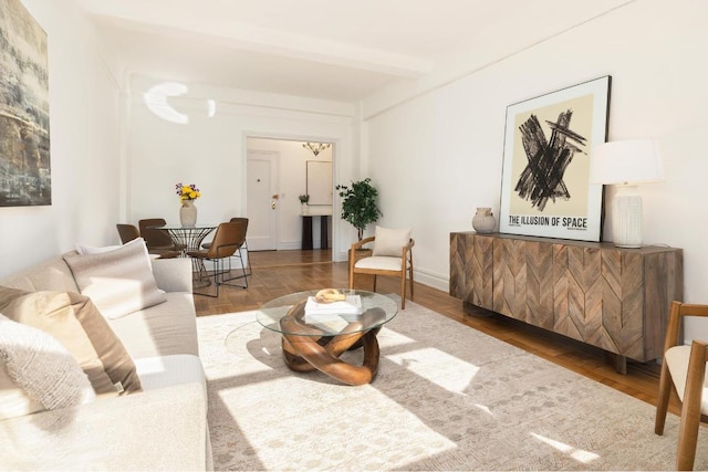 living room with beam ceiling and hardwood / wood-style floors