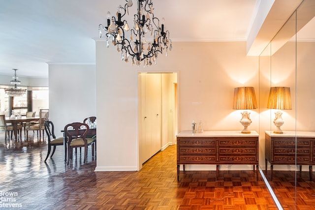 corridor with ornamental molding, dark parquet floors, and a notable chandelier