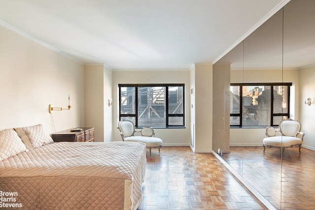 bedroom featuring baseboards and ornamental molding