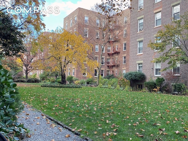 view of home's community with a yard