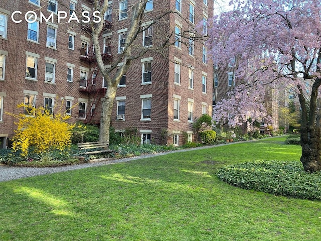 view of property's community with a yard