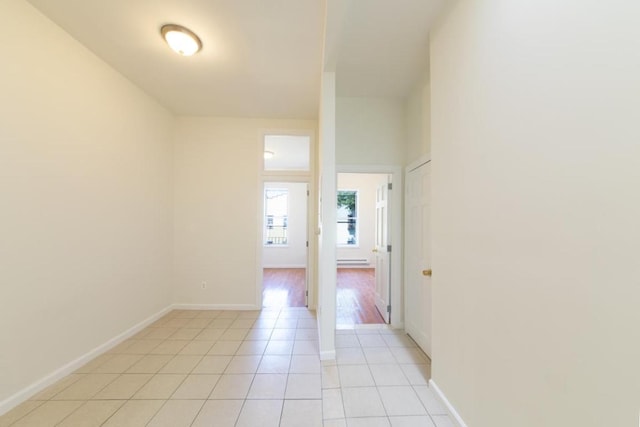 hallway with light tile patterned flooring