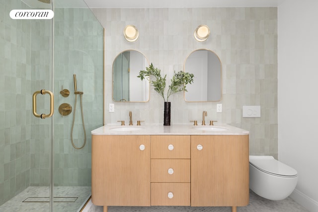 bathroom with a stall shower, a sink, and tile walls