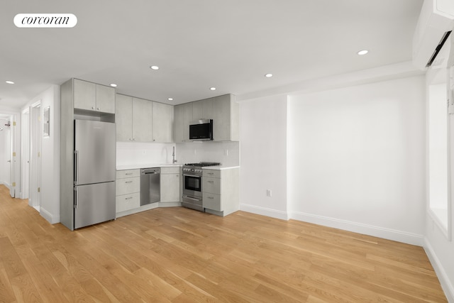 kitchen with visible vents, light wood-style flooring, appliances with stainless steel finishes, light countertops, and recessed lighting