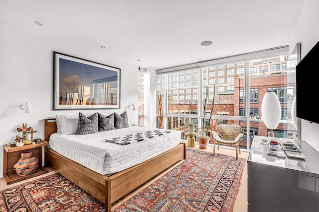 bedroom featuring floor to ceiling windows