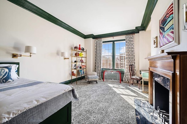 bedroom featuring crown molding, a high end fireplace, and carpet