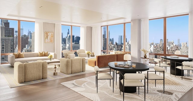 dining room with a view of city, a wall of windows, a tray ceiling, and wood finished floors