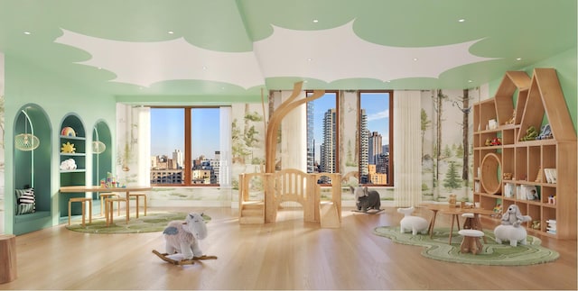 dining room with a city view and wood finished floors