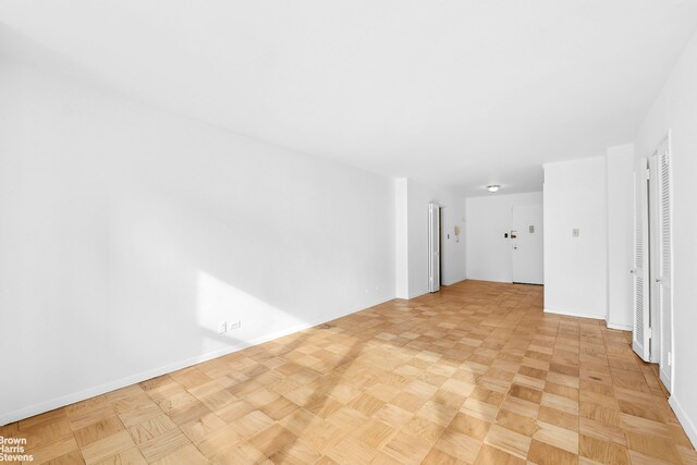 420 E 72nd St Unit 15D, New York City, NY 10021 - spare room featuring baseboards and radiator