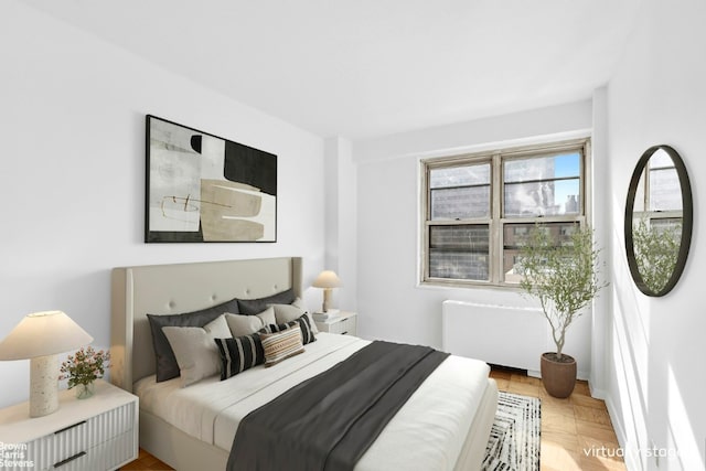 bedroom featuring light parquet floors