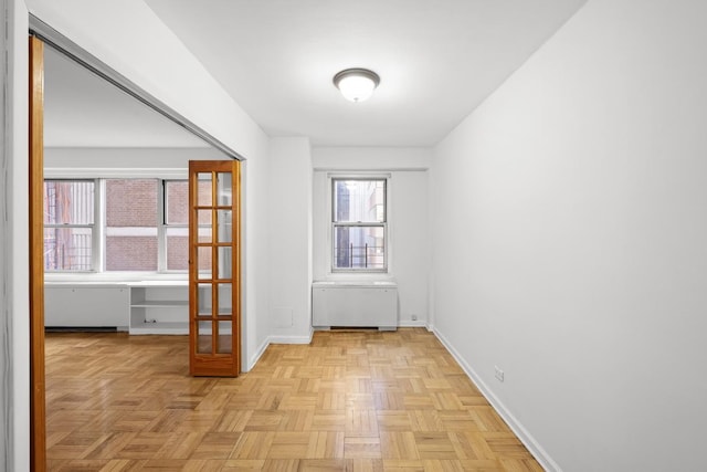 interior space featuring baseboards and radiator heating unit