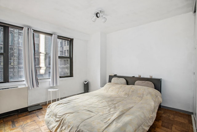 bedroom featuring baseboards