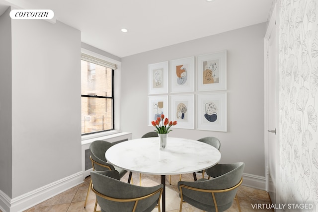 dining space featuring baseboards, recessed lighting, and light tile patterned floors