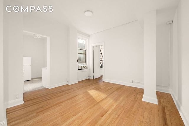 spare room featuring light hardwood / wood-style flooring