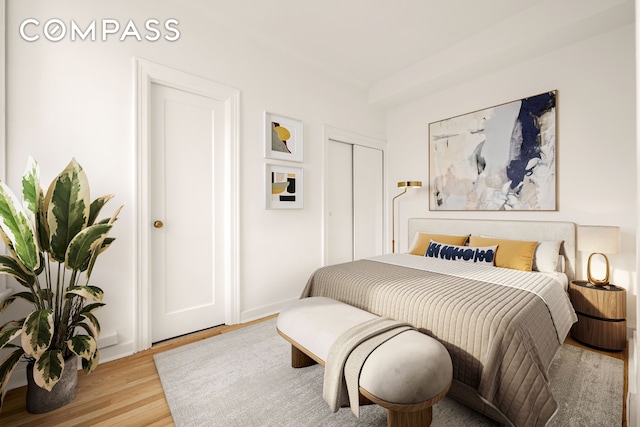 bedroom with a closet and light wood-type flooring