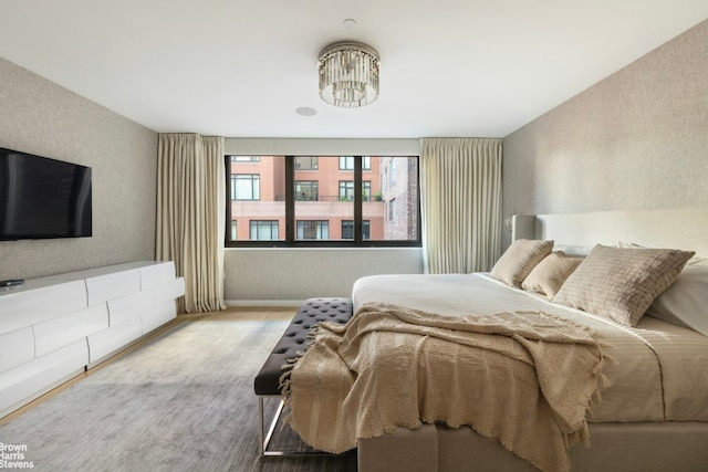 bedroom with a notable chandelier