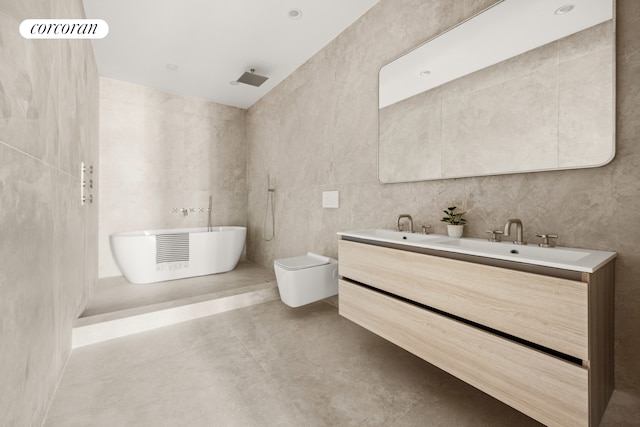 bathroom with toilet, a sink, double vanity, a soaking tub, and concrete flooring