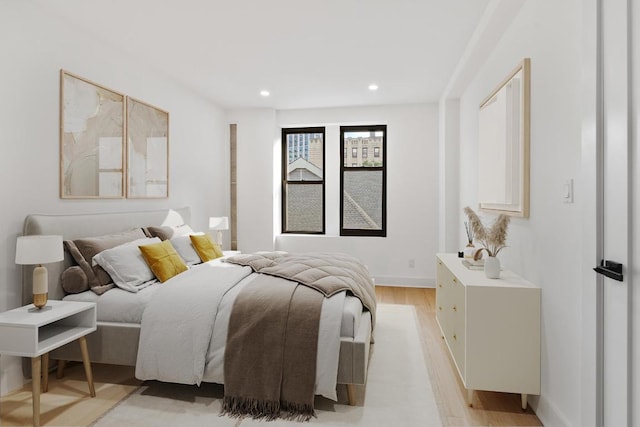 bedroom with light hardwood / wood-style floors