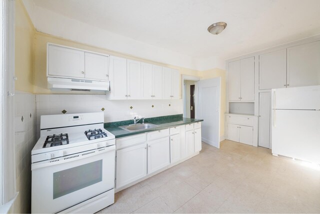 unfurnished bedroom featuring two closets and radiator heating unit