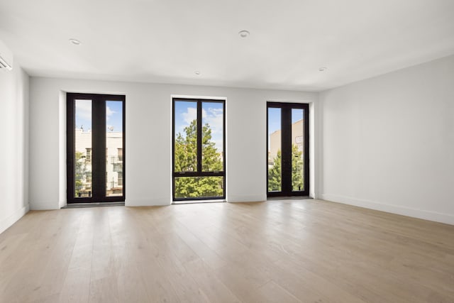 spare room featuring light hardwood / wood-style flooring