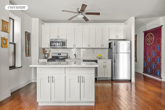 1494 Ocean Ave Unit 2K, New York City, NY 11230 - kitchen featuring stainless steel appliances, light countertops, ceiling fan, decorative backsplash, and dark wood-type flooring