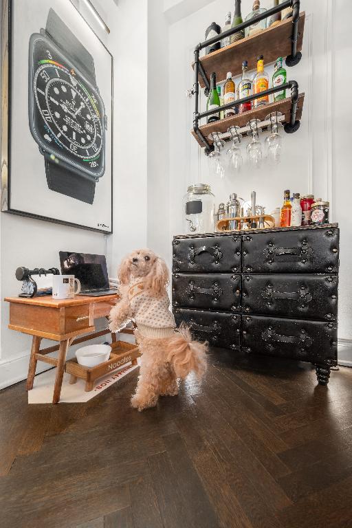 bar with hardwood / wood-style floors