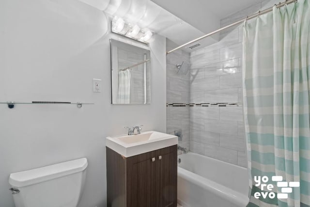 full bathroom with vanity, shower / bath combination with curtain, and toilet