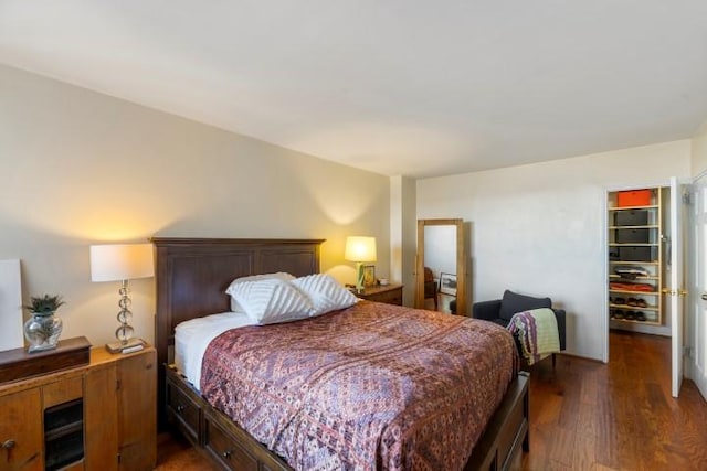 bedroom with wood finished floors