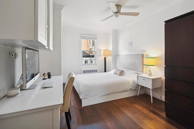 bedroom with crown molding, dark wood-type flooring, and ceiling fan