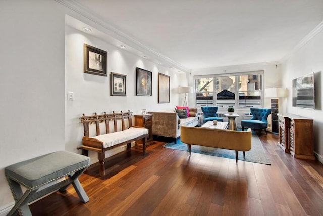 living area with ornamental molding, rail lighting, and dark wood-type flooring