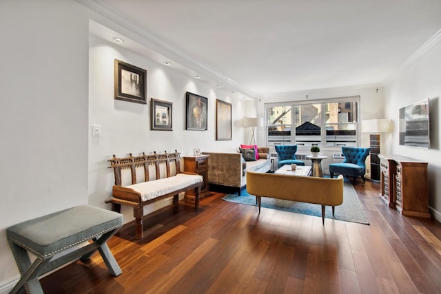 living area featuring ornamental molding and hardwood / wood-style flooring