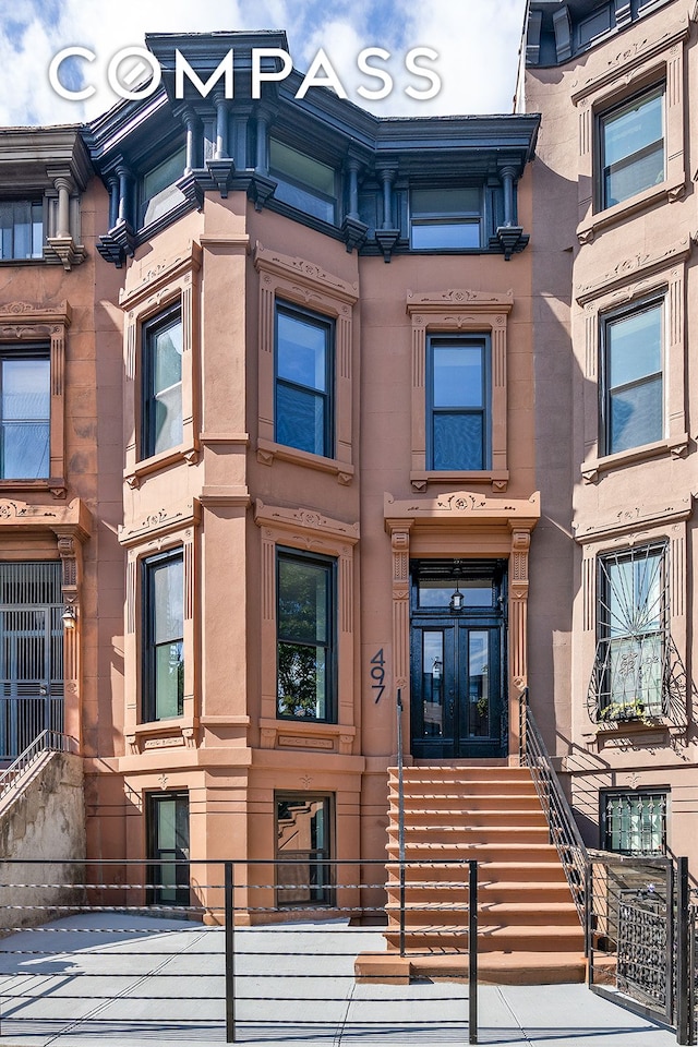 view of building exterior featuring a fenced front yard