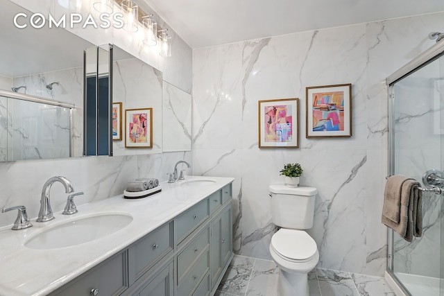 full bath with marble finish floor, a marble finish shower, and a sink