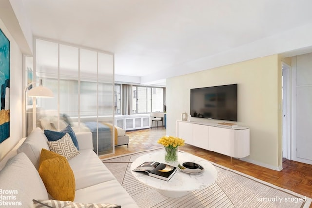 living room with radiator heating unit and light parquet floors