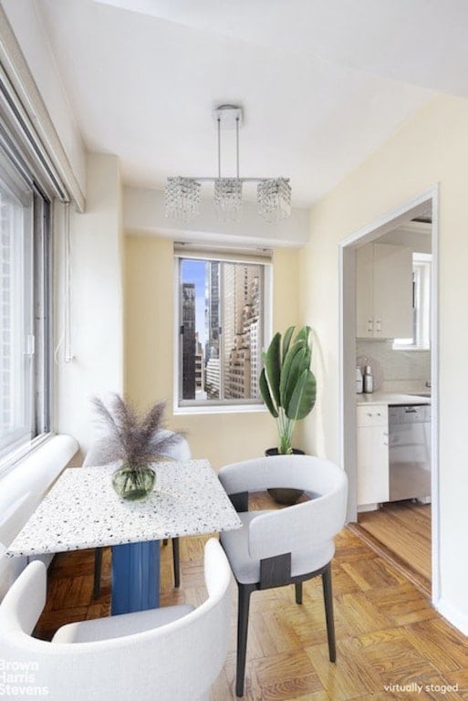 dining space with light parquet flooring and breakfast area