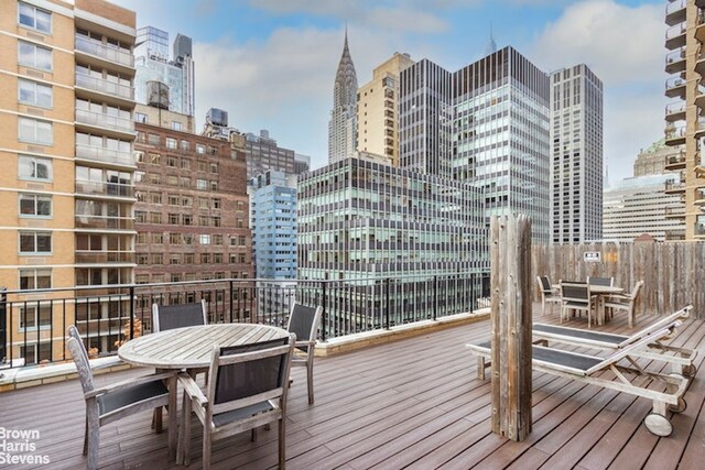 225 E 46th St Unit 12B, New York City, NY 10017 - deck with outdoor dining area and a view of city