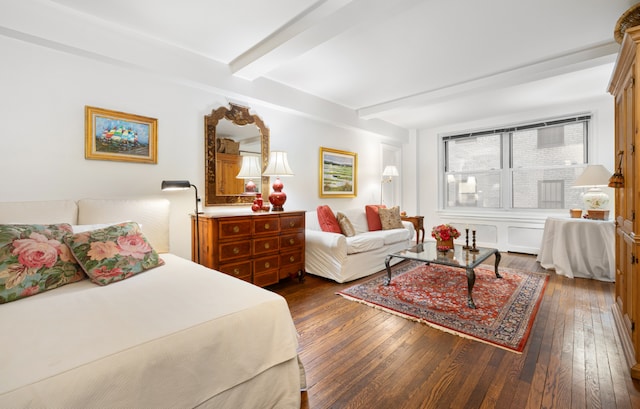 bedroom with dark wood-type flooring and beamed ceiling