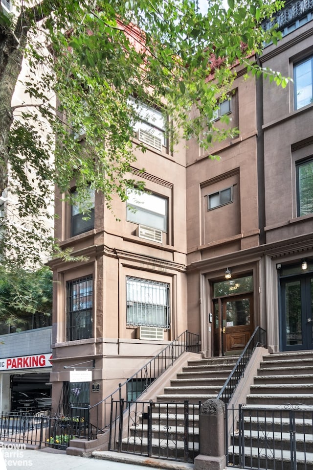 view of building exterior with a fenced front yard