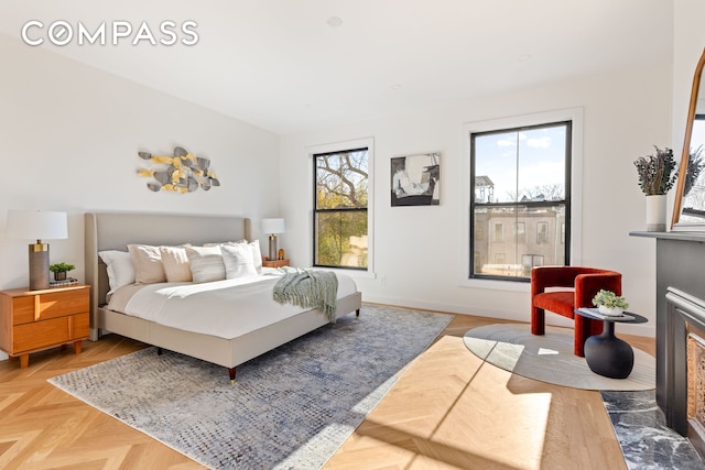 bedroom with multiple windows and baseboards