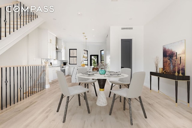 dining room with light hardwood / wood-style floors